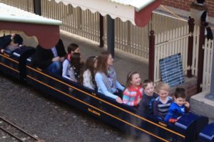 Happy children on miniature train