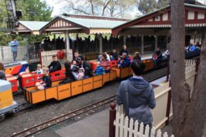 Miniature trains full of passengers