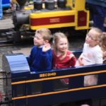 Happy children on miniature train