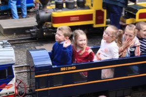 Happy children on miniature train